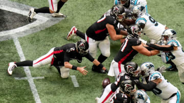 ATLANTA, GEORGIA - OCTOBER 31: Matt Ryan #2 of the Atlanta Falcons fumbles the ball in the third quarter against the Carolina Panthers at Mercedes-Benz Stadium on October 31, 2021 in Atlanta, Georgia. (Photo by Mark Brown/Getty Images)