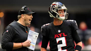 ATLANTA, GEORGIA - OCTOBER 31: Head coach Arthur Smith of the Atlanta Falcons and Matt Ryan #2 meet in the fourth quarter against the Carolina Panthers at Mercedes-Benz Stadium on October 31, 2021 in Atlanta, Georgia. (Photo by Mark Brown/Getty Images)