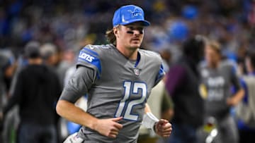 DETROIT, MICHIGAN - DECEMBER 05: Tim Boyle #12 of the Detroit Lions runs off the field at the half against the Minnesota Vikings at Ford Field on December 05, 2021 in Detroit, Michigan. (Photo by Nic Antaya/Getty Images)