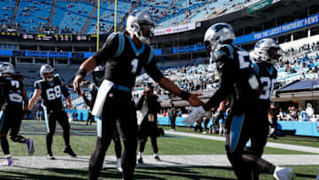 CHARLOTTE, NORTH CAROLINA - DECEMBER 12: Cam Newton #1 of the Carolina Panthers and teammates take the field for the game against the Atlanta Falcons at Bank of America Stadium on December 12, 2021 in Charlotte, North Carolina. (Photo by Grant Halverson/Getty Images)