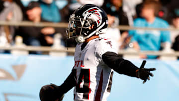 CHARLOTTE, NORTH CAROLINA - DECEMBER 12: A.J. Terrell #24 of the Atlanta Falcons celebrates after an interception in the second quarter of the game against the Carolina Panthers at Bank of America Stadium on December 12, 2021 in Charlotte, North Carolina. (Photo by Grant Halverson/Getty Images)