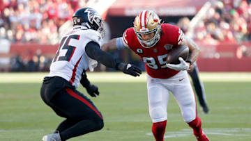 SANTA CLARA, CALIFORNIA - DECEMBER 19: George Kittle #85 of the San Francisco 49ers carries the ball against Deion Jones #45 of the Atlanta Falcons in the first quarter of the game at Levi's Stadium on December 19, 2021 in Santa Clara, California. (Photo by Lachlan Cunningham/Getty Images)