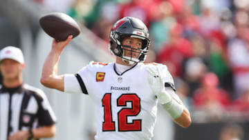 TAMPA, FLORIDA - JANUARY 16: Tom Brady #12 of the Tampa Bay Buccaneers warms up before the game against the Philadelphia Eagles in the NFC Wild Card Playoff game at Raymond James Stadium on January 16, 2022 in Tampa, Florida. (Photo by Michael Reaves/Getty Images)