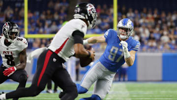 DETROIT, MICHIGAN - AUGUST 12: Aidan Hutchinson #97 of the Detroit Lions puts pressure on Marcus Mariota #1 of the Atlanta Falcons in the first quarter during a NFL preseason game at Ford Field on August 12, 2022 in Detroit, Michigan. (Photo by Gregory Shamus/Getty Images)