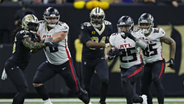 NEW ORLEANS, LOUISIANA - DECEMBER 18: Tyler Allgeier #25 of the Atlanta Falcons runs the ball during the first half in the game against the New Orleans Saints at Caesars Superdome on December 18, 2022 in New Orleans, Louisiana. (Photo by Chris Graythen/Getty Images)