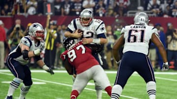 Tom Brady #12 of the New England Patriots is sacked by Grady Jarrett #97 of the Atlanta Falcons in the fourth quarter during Super Bowl 51 at NRG Stadium on February 5, 2017 in Houston, Texas. / AFP / Timothy A. CLARY (Photo credit should read TIMOTHY A. CLARY/AFP via Getty Images)