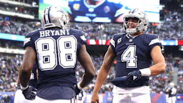 EAST RUTHERFORD, NEW JERSEY - DECEMBER 10: Dak Prescott #4 of the Dallas Cowboys celebrates a touchdown with Dez Bryant #88 in the fourth quarter against the New York Giants during the game at MetLife Stadium on December 10, 2017 in East Rutherford, New Jersey. (Photo by Elsa/Getty Images)
