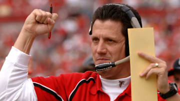 Atlanta Falcons offfensive coordinator Greg Knapp cheers a touchdown against the Tampa Bay Buccaneers December 24, 2005 in Tampa. The Bucs defeated the Falcons 27 - 24 in overtime. (Photo by Al Messerschmidt/Getty Images)