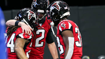 ATLANTA, GA - DECEMBER 8: Devonta Freeman #24 celebrates his touchdown with Matt Ryan #2, and Kenjon Barner #38 of the Atlanta Falcons during the second half of the game against the Carolina Panthers at Mercedes-Benz Stadium on December 8, 2019 in Atlanta, Georgia. (Photo by Carmen Mandato/Getty Images)