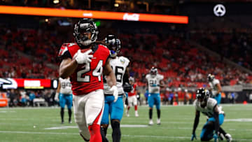 ATLANTA, GEORGIA - DECEMBER 22: Devonta Freeman #24 of the Atlanta Falcons rushes for a touchdown against the Jacksonville Jaguars in the first quarter at Mercedes-Benz Stadium on December 22, 2019 in Atlanta, Georgia. (Photo by Kevin C. Cox/Getty Images)