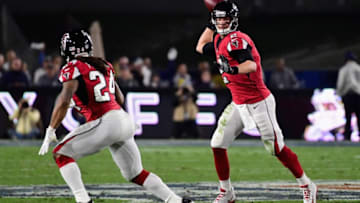 LOS ANGELES, CA - JANUARY 06: Quarterback Matt Ryan #2 of the Atlanta Falcons prepares to pass to running back Devonta Freeman #24 during the first quarter of the NFC Wild Card Playoff game against the Los Angeles Rams at Los Angeles Coliseum on January 6, 2018 in Los Angeles, California. (Photo by Harry How/Getty Images)