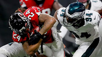 ATLANTA, GEORGIA - SEPTEMBER 15: Running back Devonta Freeman #24 of the Atlanta Falcons runs against the defense of the Philadelphia Eagles during the game at Mercedes-Benz Stadium on September 15, 2019 in Atlanta, Georgia. (Photo by Kevin C. Cox/Getty Images)