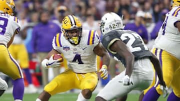 LSU running back Nick Brossette (4) runs against UCF defensive back Richie Grant (27) during the Fiesta Bowl in Glendale January 1, 2019.Fiesta Bowl