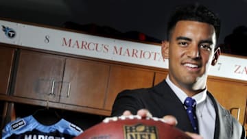 Tennessee Titans first round draft pick quarterback Marcus Mariota poses at his locker at St. Thomas Sports Park May 1, 2015 in Nashville.Nas Sig Titansmariota0502