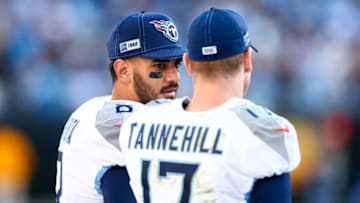Nov 3, 2019; Charlotte, NC, USA; Tennessee Titans quarterback Marcus Mariota (8) talks with quarterback Ryan Tannehill (17) during the fourth quarter against the Carolina Panthers at Bank of America Stadium. Mandatory Credit: Jeremy Brevard-USA TODAY Sports