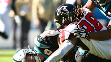 Nov 17, 2019; Charlotte, NC, USA; Carolina Panthers quarterback Kyle Allen (7) gets sacked by Atlanta Falcons defensive end Takkarist McKinley (98) during the first quarter at Bank of America Stadium. Mandatory Credit: Jeremy Brevard-USA TODAY Sports