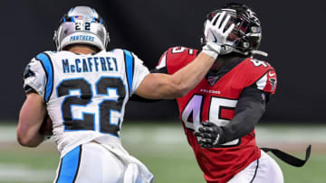 Dec 8, 2019; Atlanta, GA, USA; Carolina Panthers running back Christian McCaffrey (22) tries to break out of a tackle by Atlanta Falcons linebacker Deion Jones (45) during the second half at Mercedes-Benz Stadium. Mandatory Credit: Dale Zanine-USA TODAY Sports