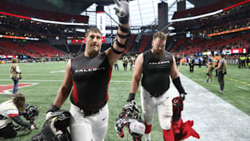 Dec 22, 2019; Atlanta, Georgia, USA; Atlanta Falcons center Alex Mack (51, left) and guard Wes Schweitzer (71) reacts after they defeated the Jacksonville Jaguars at Mercedes-Benz Stadium. Mandatory Credit: Jason Getz-USA TODAY Sports