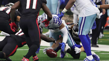 Sep 20, 2020; Arlington, Texas, USA; Dallas Cowboys cornerback C.J. Goodwin (29) recovers an on-side kick in the fourth quarter against the Atlanta Falcons at AT&T Stadium. Mandatory Credit: Matthew Emmons-USA TODAY Sports