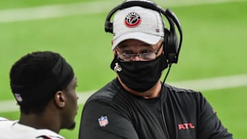 Oct 18, 2020; Minneapolis, Minnesota, USA; Atlanta Falcons head coach Raheem Morris talks with wide receiver Olamide Zaccheaus (17) during the first quarter against the Minnesota Vikings at U.S. Bank Stadium. Mandatory Credit: Jeffrey Becker-USA TODAY Sports
