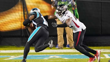 Oct 29, 2020; Charlotte, North Carolina, USA; Carolina Panthers wide receiver Curtis Samuel (10) goes in for the score past Atlanta Falcons strong safety Keanu Neal (22) during the first quarter at Bank of America Stadium. Mandatory Credit: Jim Dedmon-USA TODAY Sports