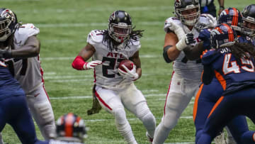 Nov 8, 2020; Atlanta, Georgia, USA; Atlanta Falcons running back Todd Gurley II (21) runs against the Denver Broncos during the second half at Mercedes-Benz Stadium. Mandatory Credit: Dale Zanine-USA TODAY Sports