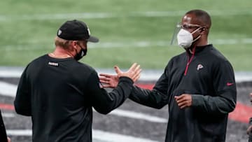 Nov 29, 2020; Atlanta, Georgia, USA; Las Vegas Raiders head coach John Gruden (left) and Atlanta Falcons head coach Raheem Morris shake hands after a game at Mercedes-Benz Stadium. Mandatory Credit: Dale Zanine-USA TODAY Sports