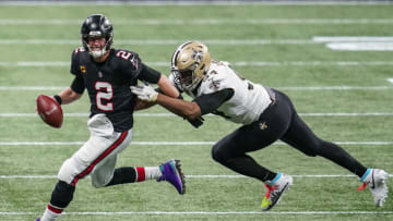 Dec 6, 2020; Atlanta, Georgia, USA; Atlanta Falcons quarterback Matt Ryan (2) runs to escape a tackle by New Orleans Saints defensive end Cameron Jordan (94) during the second half at Mercedes-Benz Stadium. Mandatory Credit: Dale Zanine-USA TODAY Sports