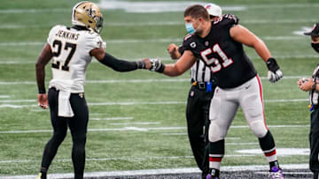 Dec 6, 2020; Atlanta, Georgia, USA; New Orleans Saints safety Malcolm Jenkins (27) and Atlanta Falcons center Alex Mack (51) meet as captains at mid field prior to the game at Mercedes-Benz Stadium. Mandatory Credit: Dale Zanine-USA TODAY Sports