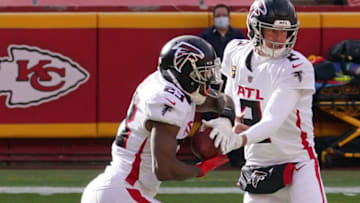 Dec 27, 2020; Kansas City, MO, USA; Atlanta Falcons quarterback Matt Ryan (2) hands off to running back Brian Hill (23) against the Kansas City Chiefs in the first half of a NFL game at Arrowhead Stadium. Mandatory Credit: Denny Medley-USA TODAY Sports