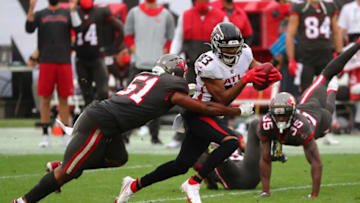 Jan 3, 2021; Tampa, Florida, USA; Atlanta Falcons wide receiver Russell Gage (83) runs with the ball as Tampa Bay Buccaneers linebacker Kevin Minter (51) defends during the second half at Raymond James Stadium. Mandatory Credit: Kim Klement-USA TODAY Sports