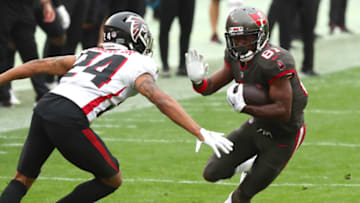 Jan 3, 2021; Tampa, Florida, USA; Tampa Bay Buccaneers wide receiver Antonio Brown (81) runs with the ball as Atlanta Falcons cornerback A.J. Terrell (24) attempted to defend during the second half at Raymond James Stadium. Mandatory Credit: Kim Klement-USA TODAY Sports