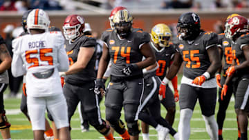 Jan 30, 2021; Mobile, AL, USA; National offensive lineman Jaylon Moore of Western Michigan (74) and National offensive lineman James Hudson III of Cincinnati (55) walk tot the line in the first half of the 2021 Senior Bowl at Hancock Whitney Stadium. Mandatory Credit: Vasha Hunt-USA TODAY Sports