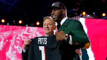 Apr 29, 2021; Cleveland, Ohio, USA; Kyle Pitts (Florida) with NFL commissioner Roger Goodell after being selected by Atlanta Falcons as the number four overall pick in the first round of the 2021 NFL Draft at First Energy Stadium. Mandatory Credit: Kirby Lee-USA TODAY Sports