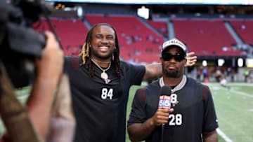 Aug 13, 2021; Atlanta, Georgia, USA; Atlanta Falcons running back Cordarrelle Patterson (84) and running back Mike Davis (28) talk to a local television station before the Atlanta Falcons game against the Tennessee Titans at Mercedes-Benz Stadium. Mandatory Credit: Jason Getz-USA TODAY Sports