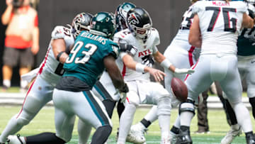 Sep 12, 2021; Atlanta, Georgia, USA; Atlanta Falcons quarterback Matt Ryan (2) fumbles the ball after being hit by the Philadelphia Eagles defenders during the second half at Mercedes-Benz Stadium. Mandatory Credit: Dale Zanine-USA TODAY Sports