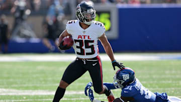 Sep 26, 2021; East Rutherford, New Jersey, USA; Atlanta Falcons cornerback Avery Williams (35) avoids a tackle by New York Giants defensive back Keion Crossen (31) during the first quarter at MetLife Stadium. Mandatory Credit: Vincent Carchietta-USA TODAY Sports