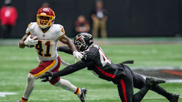Oct 3, 2021; Atlanta, Georgia, USA; Washington Football Team running back J.D. McKissic (41) breaks a tackle by Atlanta Falcons linebacker Deion Jones (45) before running for a touchdown against the Atlanta Falcons during the fourth quarter at Mercedes-Benz Stadium. Mandatory Credit: Dale Zanine-USA TODAY Sports