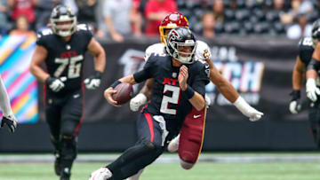 Oct 3, 2021; Atlanta, Georgia, USA; Atlanta Falcons quarterback Matt Ryan (2) runs the ball against the Washington Football Team in the second half at Mercedes-Benz Stadium. Mandatory Credit: Brett Davis-USA TODAY Sports