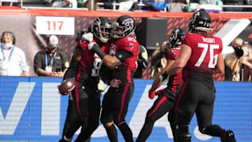 Oct 10, 2021; London, England, United Kingdom; Atlanta Falcons tight end Kyle Pitts (8) celebrates with tight end Lee Smith (85) after scoring on a two-yard touchdown reception in the first quarter against the New York Jets during an NFL International Series game at Tottenham Hotspur Stadium. The Falcons defeated the Jets 27-20. Mandatory Credit: Kirby Lee-USA TODAY Sports