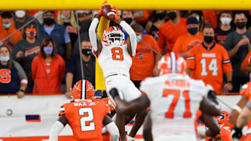 Oct 15, 2021; Syracuse, New York, USA; Clemson Tigers wide receiver Justyn Ross (8) catches the ball in front of Syracuse Orange linebacker Marlowe Wax (2) during the first half at the Carrier Dome. Mandatory Credit: Rich Barnes-USA TODAY Sports