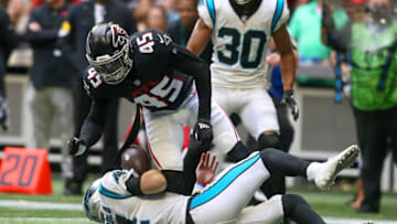 Oct 31, 2021; Atlanta, Georgia, USA; Carolina Panthers quarterback Sam Darnold (14) is hit after a slide by Atlanta Falcons linebacker Deion Jones (45) in the second half at Mercedes-Benz Stadium. Mandatory Credit: Brett Davis-USA TODAY Sports