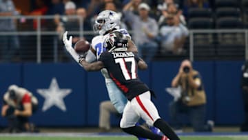 Nov 14, 2021; Arlington, Texas, USA; Dallas Cowboys cornerback Anthony Brown (30) intercepts a pass against Atlanta Falcons wide receiver Olamide Zaccheaus (17) in the third quarter at AT&T Stadium. Mandatory Credit: Tim Heitman-USA TODAY Sports