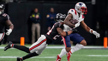 Nov 18, 2021; Atlanta, Georgia, USA; Atlanta Falcons cornerback A.J. Terrell (24) tackles New England Patriots wide receiver Kendrick Bourne (84) during the first half at Mercedes-Benz Stadium. Mandatory Credit: Dale Zanine-USA TODAY Sports