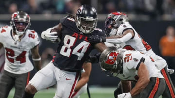 Dec 5, 2021; Atlanta, Georgia, USA; Atlanta Falcons running back Cordarrelle Patterson (84) runs against Tampa Bay Buccaneers cornerback Sean Murphy-Bunting (23) and running back Darwin Thompson (34) during the second half at Mercedes-Benz Stadium. Mandatory Credit: Dale Zanine-USA TODAY Sports