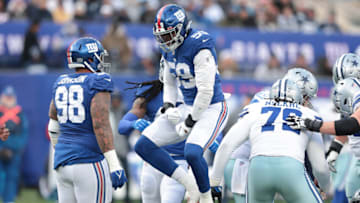 Dec 19, 2021; East Rutherford, New Jersey, USA; New York Giants outside linebacker Lorenzo Carter (59) celebrates a sack against the Dallas Cowboys during the second half at MetLife Stadium. Mandatory Credit: Vincent Carchietta-USA TODAY Sports
