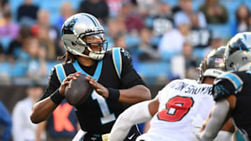 Dec 26, 2021; Charlotte, North Carolina, USA; Carolina Panthers quarterback Cam Newton (1) looks to pass as Tampa Bay Buccaneers outside linebacker Joe Tryon-Shoyinka (9) pressures in the third quarter at Bank of America Stadium. Mandatory Credit: Bob Donnan-USA TODAY Sports