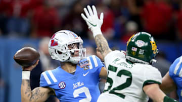 Jan 1, 2022; New Orleans, LA, USA; Mississippi Rebels quarterback Matt Corral (2) is pressured by Baylor Bears linebacker Matt Jones (52) in the first quarter of the 2022 Sugar Bowl at the Caesars Superdome. Mandatory Credit: Chuck Cook-USA TODAY Sports