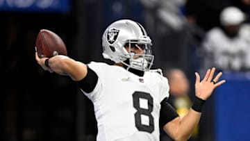Jan 2, 2022; Indianapolis, Indiana, USA; Las Vegas Raiders quarterback Marcus Mariota (8) throws a ball during warmups before the game against the Indianapolis Colts at Lucas Oil Stadium. Mandatory Credit: Marc Lebryk-USA TODAY Sports
