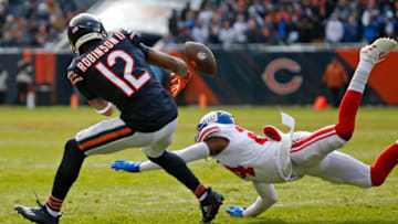 Jan 2, 2022; Chicago, Illinois, USA; New York Giants cornerback James Bradberry (24) breaks up a pass intended for Chicago Bears wide receiver Allen Robinson (12) during the first half at Soldier Field. Mandatory Credit: Jon Durr-USA TODAY Sports